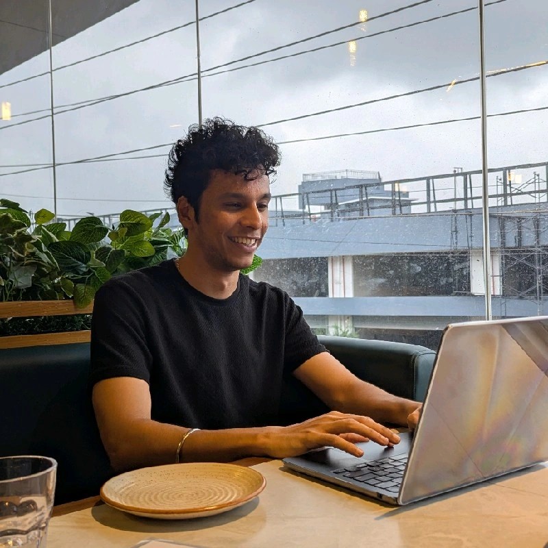 Karan Handa working on a laptop